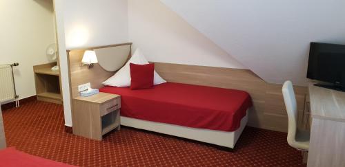 Postel nebo postele na pokoji v ubytování Aparthotel Wangener Landhaus