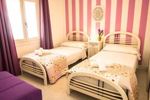 Postel nebo postele na pokoji v ubytování Villas Guzman - Belvic