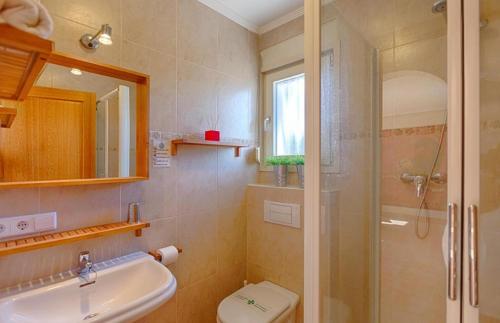 a bathroom with a shower and a sink and a toilet at Villas Guzman - Chirla in Calpe