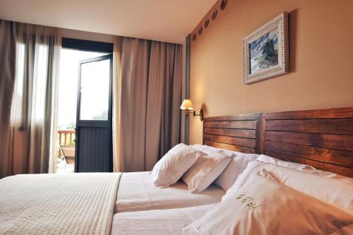 Letto o letti in una camera di Quinta de San Amaro Rias Baixas