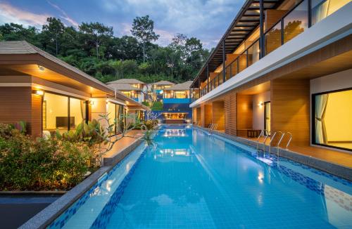 a swimming pool in the middle of a building at Cher​mantra​ Aonang​ Resort & Pool​ Suite in Ao Nang Beach