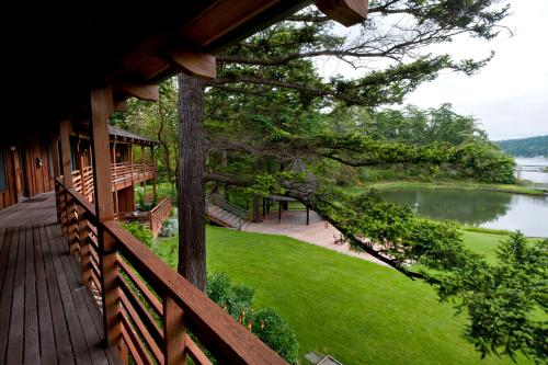 a porch of a house with a view of a lake at Captain Whidbey in Coupeville