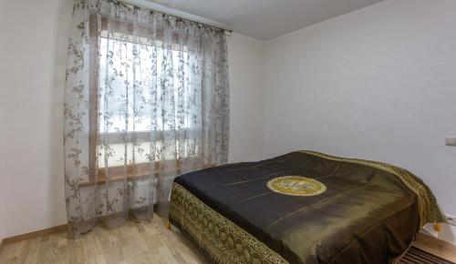 Katil atau katil-katil dalam bilik di Violetos Lux Apartamentai