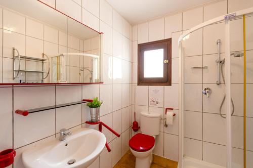 a bathroom with a toilet and a sink and a shower at Villas Guzman - Kismet in Moraira