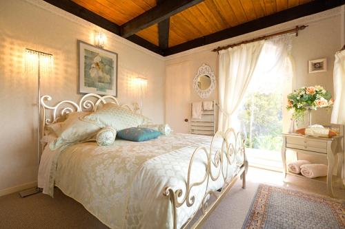 Ένα ή περισσότερα κρεβάτια σε δωμάτιο στο Tivoli Homestay