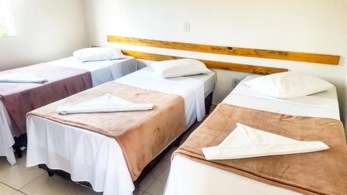 Cama ou camas em um quarto em Chalé Alto da Serra SP