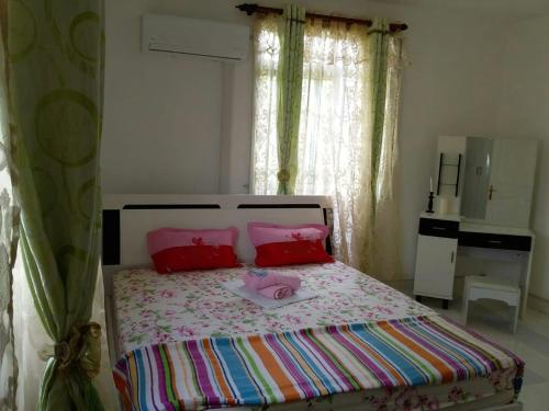Posteľ alebo postele v izbe v ubytovaní Ylang Ylang Garden Home