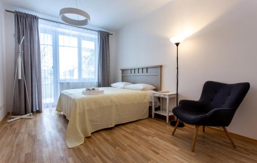 Postel nebo postele na pokoji v ubytování Violetos Lux Apartamentai2