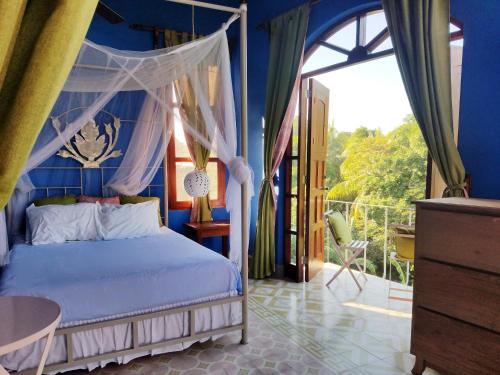 Giường trong phòng chung tại Secret Cottage Granada Nicaragua