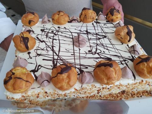 a cake with cookies and marshmallows on top of it at Park Hotel Cattolica & Restaurant in Cattolica