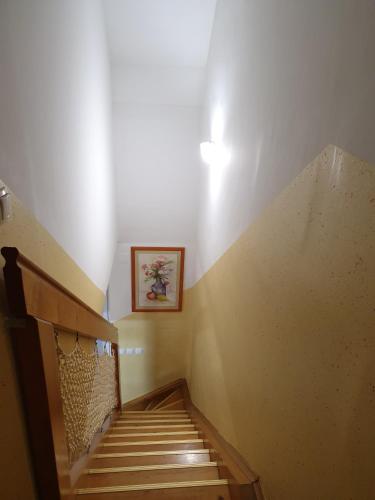 a stairway with a picture on the wall at Terme Čatež Apartma Nine in Čatež ob Savi