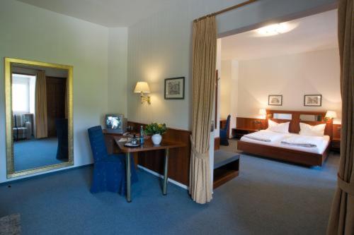 En eller flere senge i et værelse på Hotel Haus Reichert