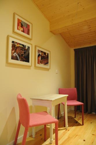 a room with a table and two chairs and a table at Naya-Downtown Guesthouse in Porto