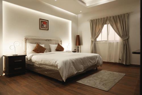 Säng eller sängar i ett rum på Amaaria Aquapark resort Villas & Chalet