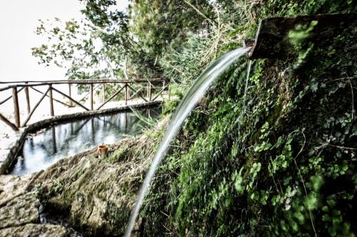 a stream of water coming out of a car at Borgo Rosso di Sera - Resort Country Chic in San Lucido