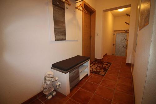 a hallway of a house with a tile floor at Apart Melanie in Zell am Ziller