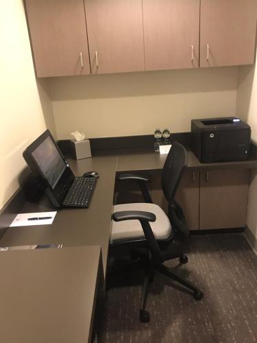 an office with a desk with a laptop and a chair at Morrison Clark Inn Washington DC Convention Center in Washington