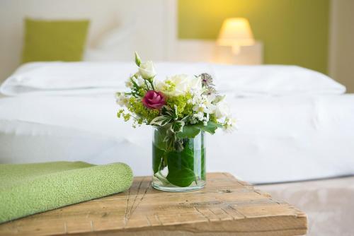 Ein Bett oder Betten in einem Zimmer der Unterkunft Paulsen's Landhotel und Restaurant