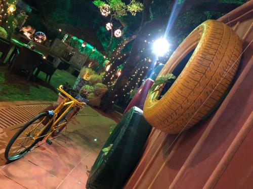 a tire hanging on the side of a car at Evershine Resort & Spa in Mahabaleshwar