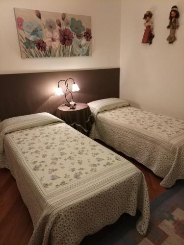 Katil atau katil-katil dalam bilik di Marinella B&B