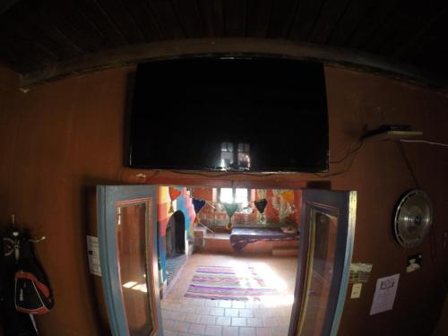 the inside of a train cabin with a window at El Farolito Hostel in Tilcara