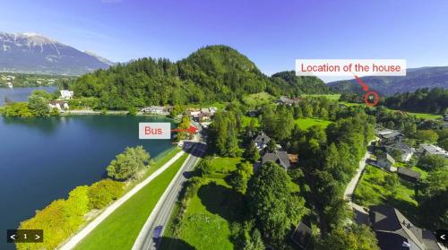 an aerial view of a house on a lake at Tourist house Capricorn in Bled