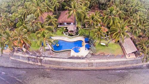 an aerial view of a resort with a swimming pool at Agung Bali Nirwana Villas and Spa in Tejakula