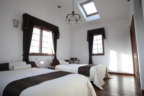 Katil atau katil-katil dalam bilik di Pine house in nemu Iseshima