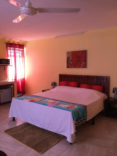 a bedroom with a large bed in a room at Bob Apartments in Calodyne