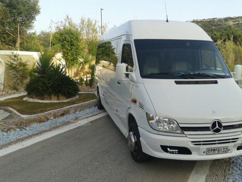 a white van parked on the side of a street at Toulas Studios & Apts No2 in Faliraki