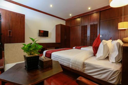 Cama o camas de una habitación en The Moon Residence & Spa
