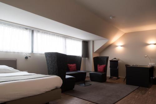 Postel nebo postele na pokoji v ubytování Hotel Karmel