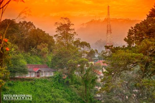 a picture of a house in the middle of a forest at Hotel Serendib Hill in Bandarawela