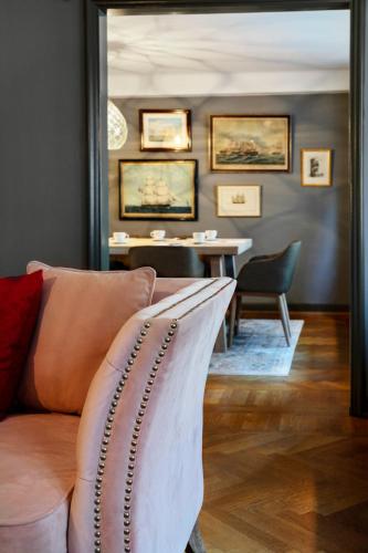 a living room with a couch and a table at Victory Apartments in Stockholm