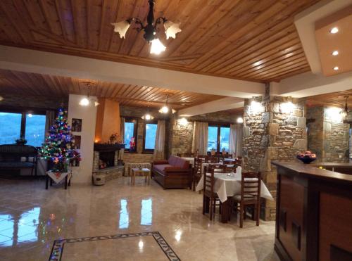 a lobby with a christmas tree in the center of a building at Evridiki in Zagora