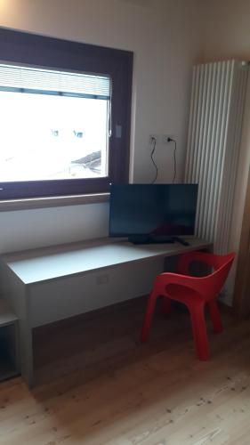 TV in/ali zabaviščno središče v nastanitvi Hotel Albrici