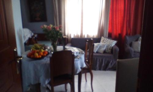 a living room with a table with fruit on it at Lepa Kuca in Spáta