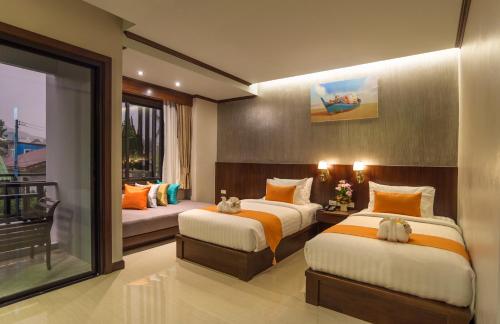 Postel nebo postele na pokoji v ubytování Andaman Breeze Resort