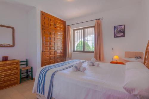 Säng eller sängar i ett rum på Villas Guzman - Romani