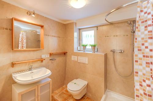 a bathroom with a sink and a toilet and a shower at Villas Guzman - Romero in Calpe