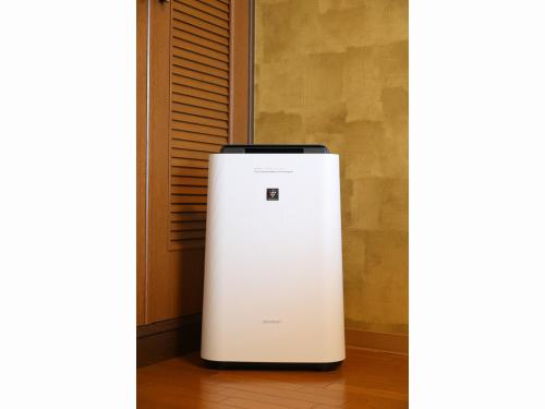 a white refrigerator is sitting on a floor at Comfort stay Miyabi in Chichibu