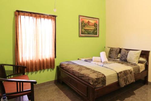 Giường trong phòng chung tại Kubu Turah Homestay