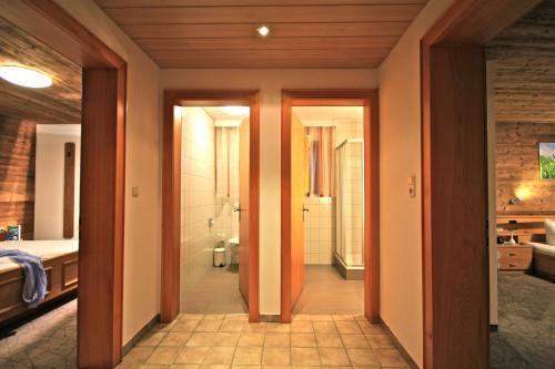 a room with a bathroom with a toilet and a sink at Haus Roswitha in Damuls