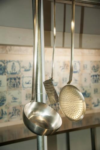 three metal utensils are hanging on a rack at Agriturismo Cozzo di Papaleo in Ragusa