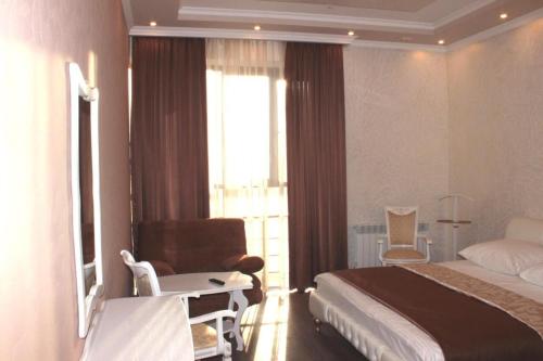 Säng eller sängar i ett rum på Hotel Ershov