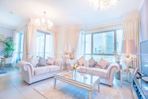 a living room with two couches and a table at Elite Royal Apartment | Burj Residences Tower 5 | Gold in Dubai