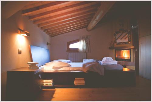 A bed or beds in a room at Agriturismo Costa Etrusca