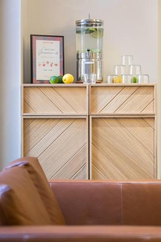 a wooden shelf with fruit on top of it at Hôtel Innes by HappyCulture in Toulouse