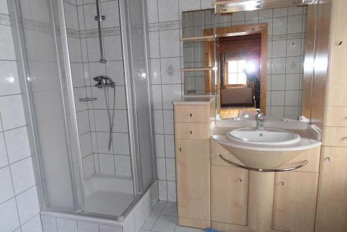a bathroom with a sink and a shower at Bauernhof Hatzlhof in Schöder