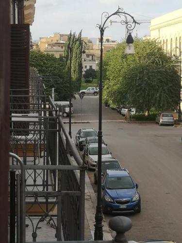 a row of cars parked in a parking lot at Sunshine Hostel Palermo in Palermo